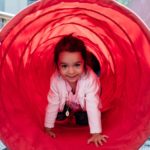 little girl in red tube